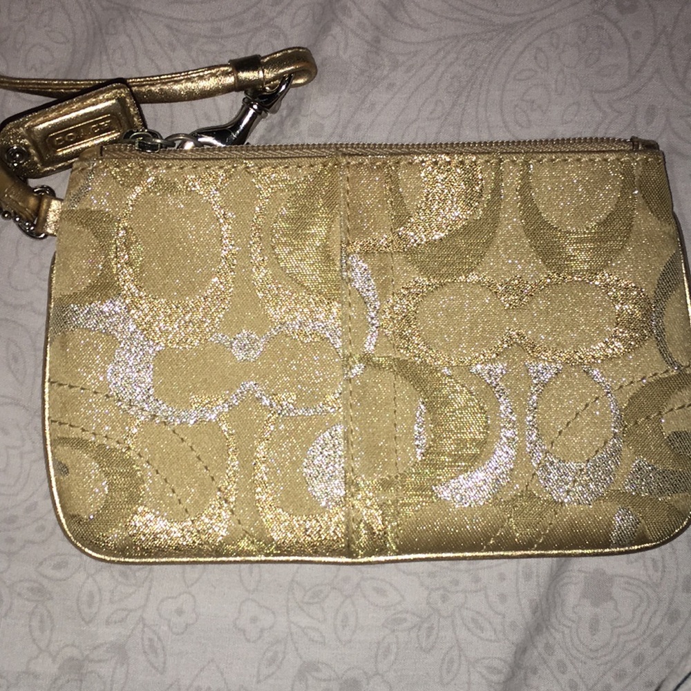 Coach strap wristlet. Tan with sparkly gold and silver C’s